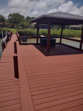 Deck staining in Oak Hill, FL by Fellman Painting & Waterproofing.